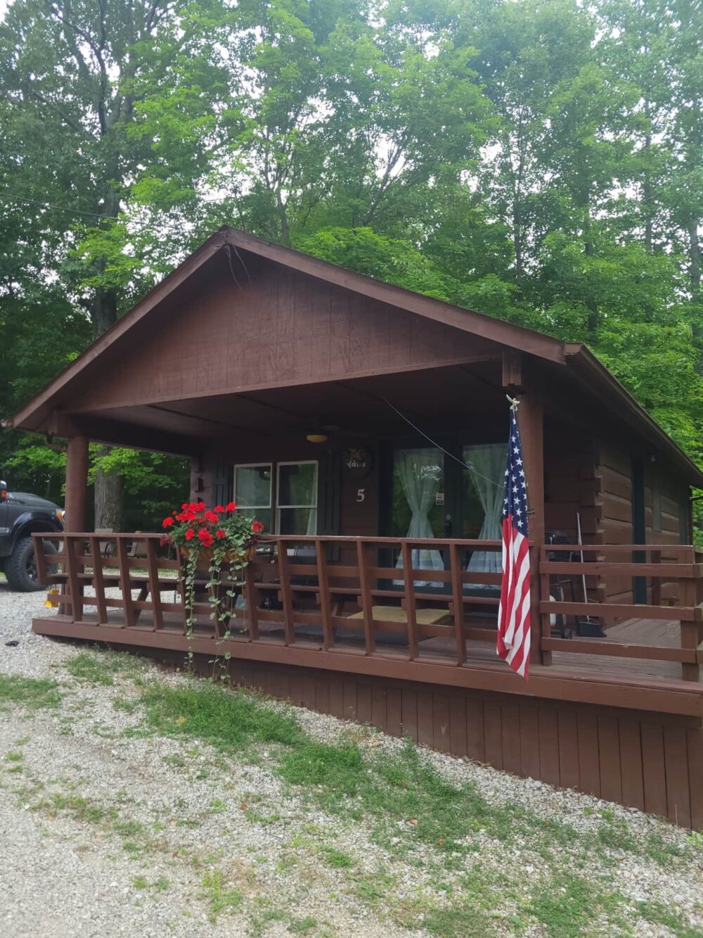 A cabin's porch at French Lick Cabins At Patoka Lake Village