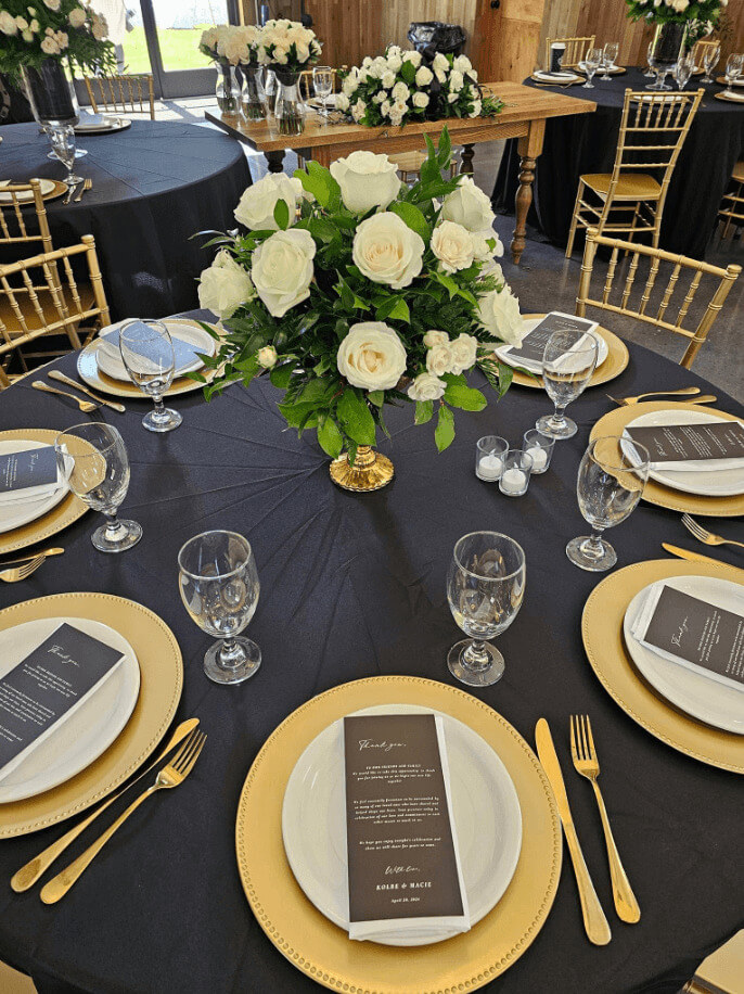 A table set for AC Floral and Event Company