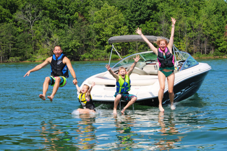 Family jumping in the lake at Patoka Lake Marina