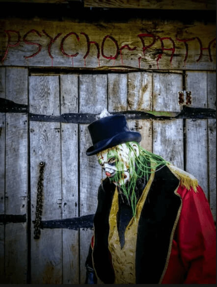 A costumed actor at PsychoPath Haunted Attraction