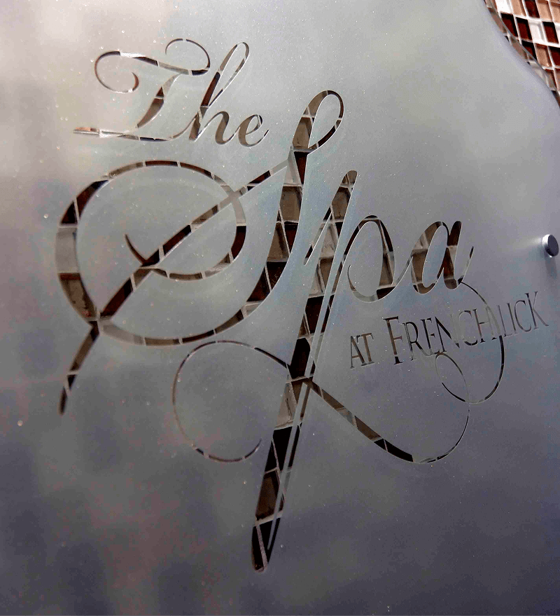 Spa sign etched into a door
